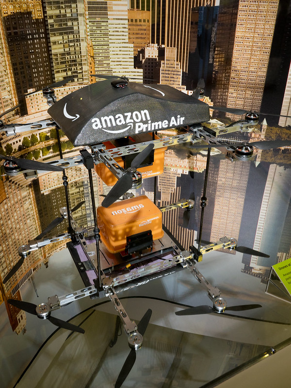 Prototype of one of the Amazon Air drones delivering a parcel.
